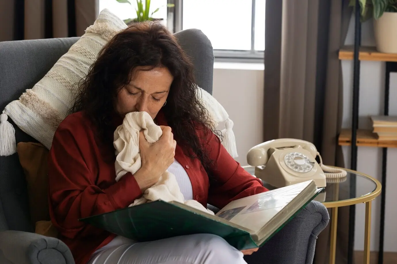 A woman looking through picture albums
